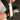 White LC-10 lace converter being fastened around a black boxing glove